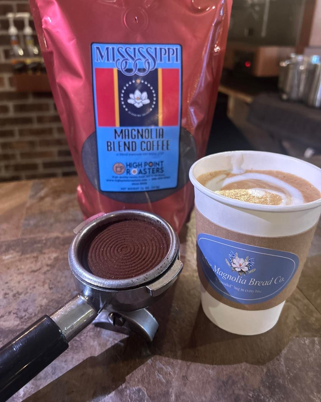 A bag of mississippi blend coffee next to a cup of coffee