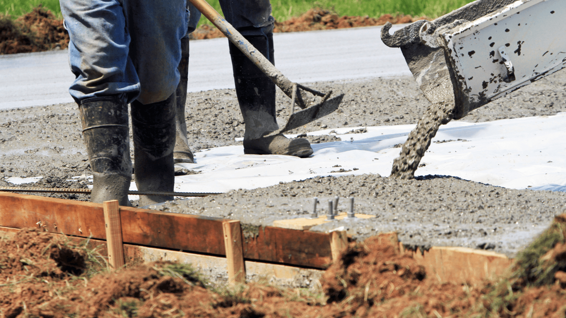 Concrete contractor finishing up a driveway in blaine, mn