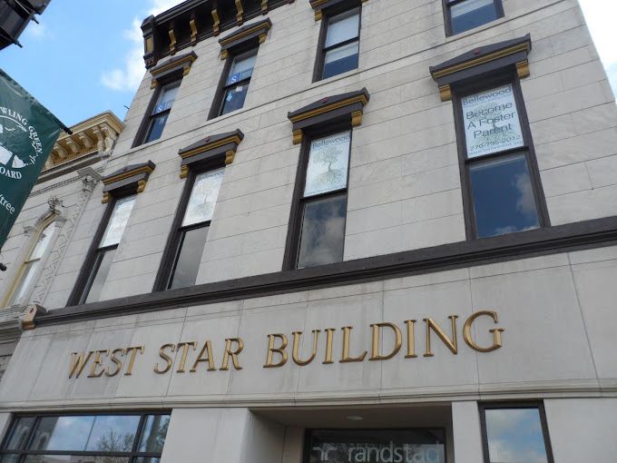 A building with the name west star building on it