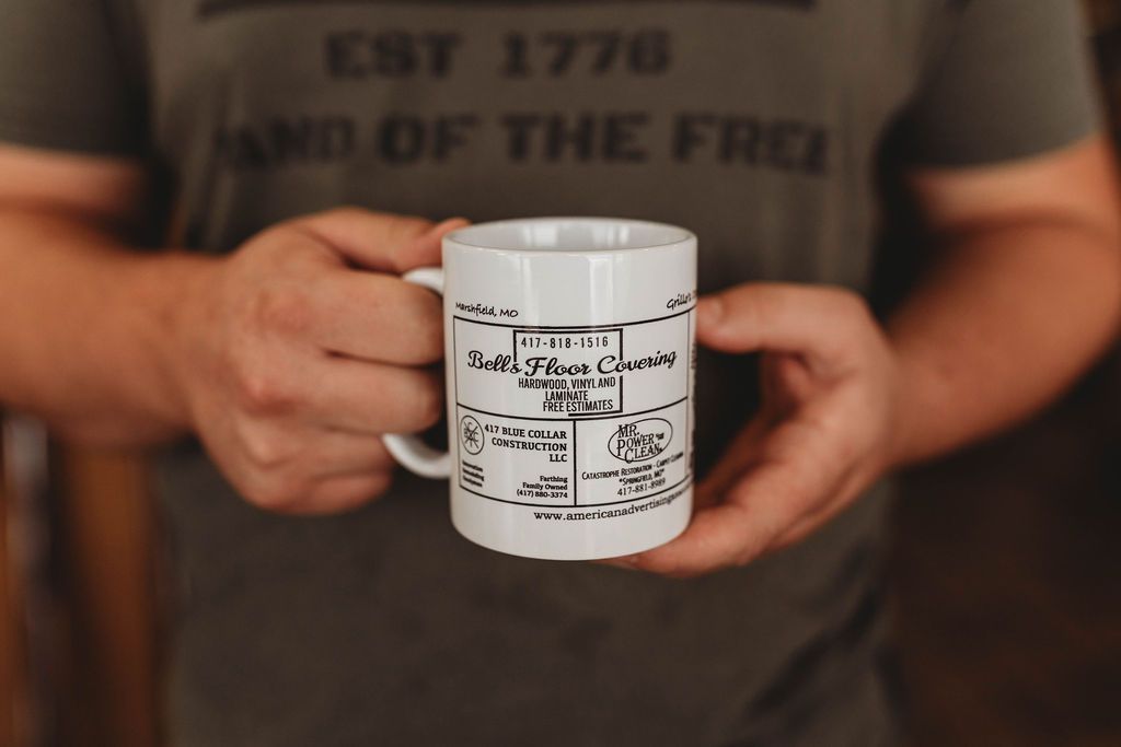 Man is Holding a Coffee Mug —  Willow Springs, MO — American Advertising Associates