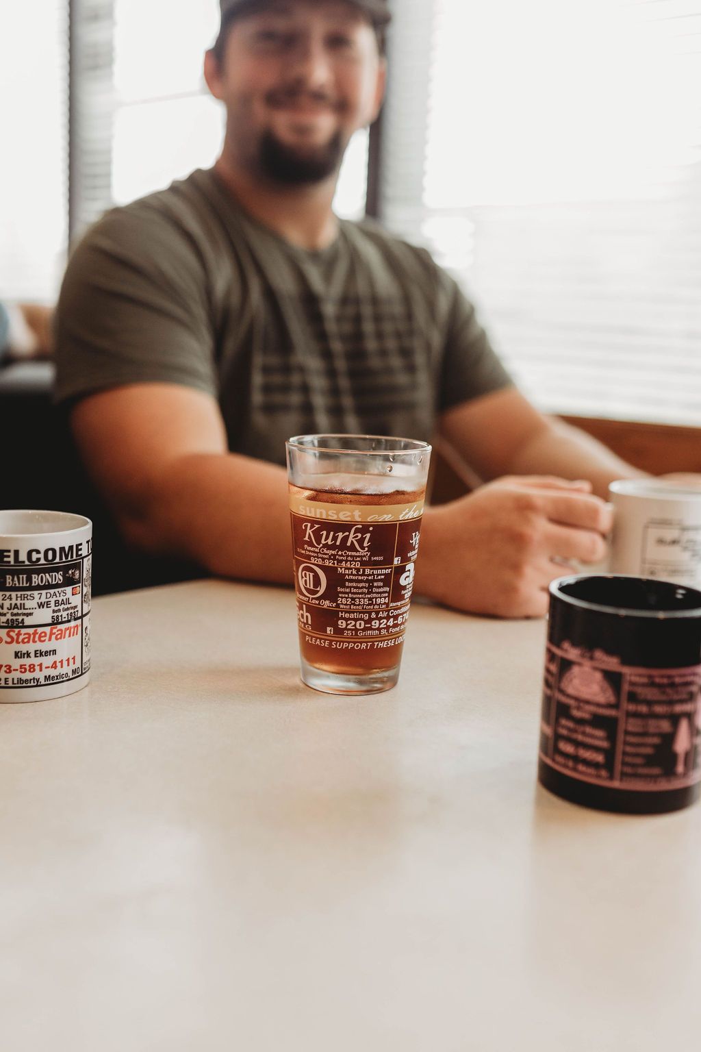 Man is Sitting on the Table —  Willow Springs, MO — American Advertising Associates