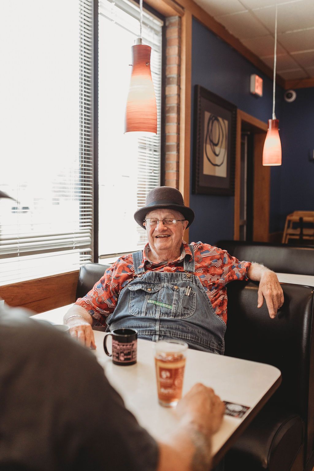 Man Sitting on the Table —  Willow Springs, MO — American Advertising Associates