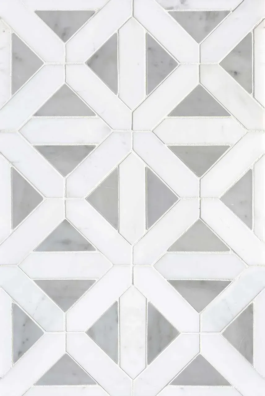 A close up of a tile with a geometric pattern on it.