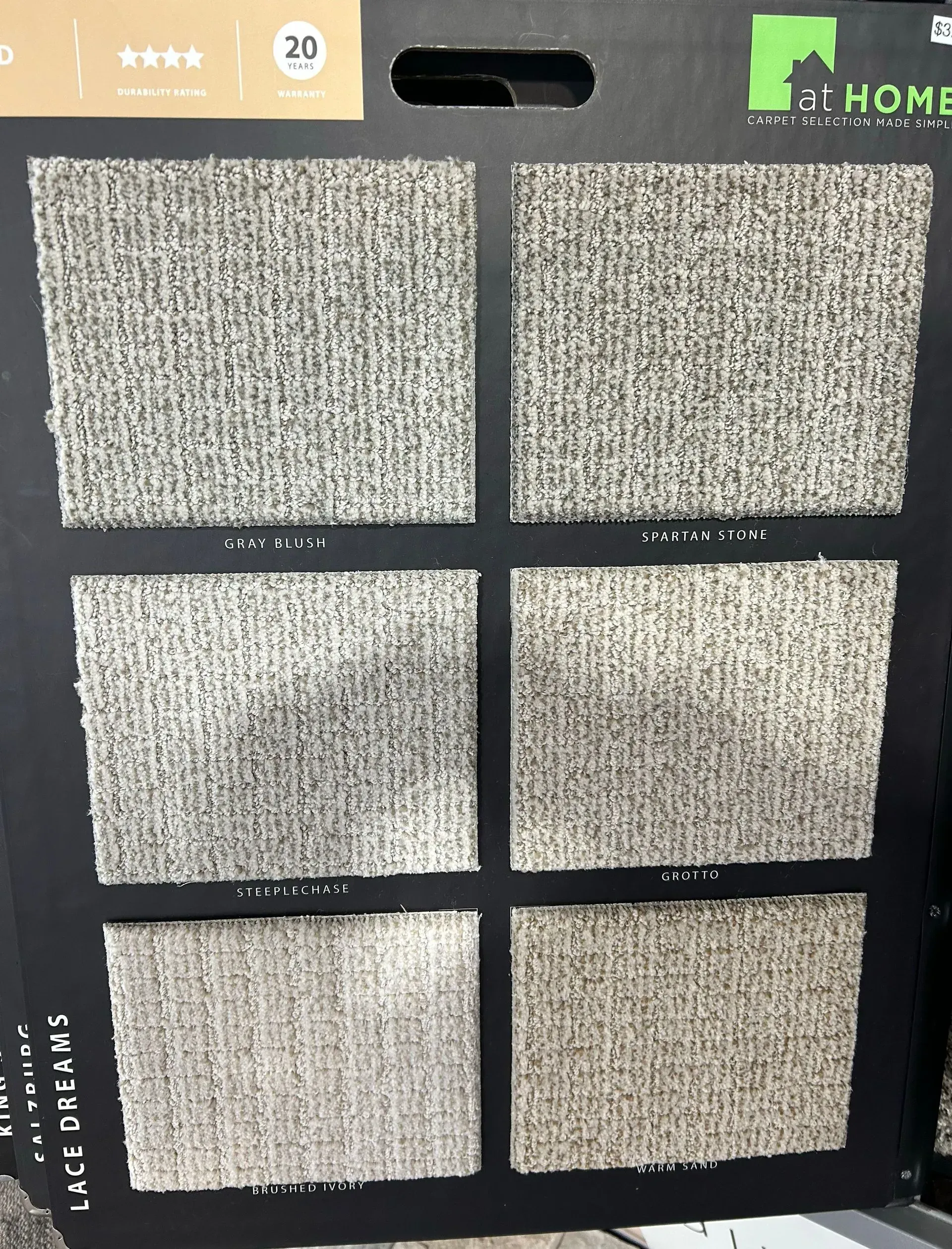 A display of carpets with the word home on it