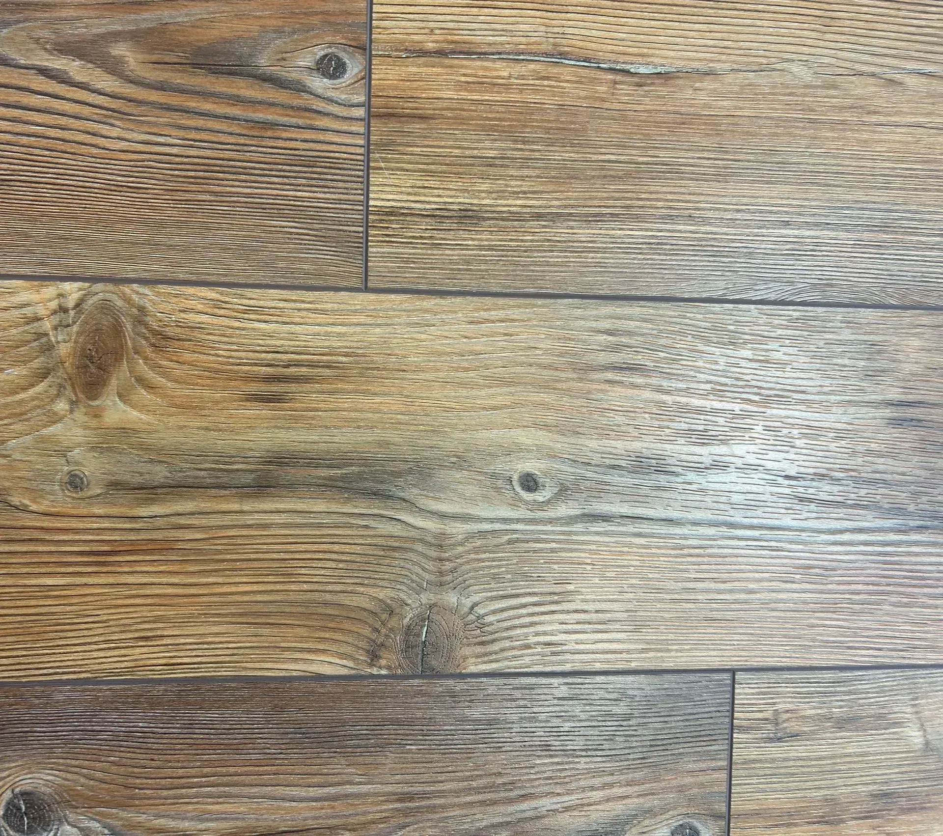 A close up of a wooden floor with a lot of grain