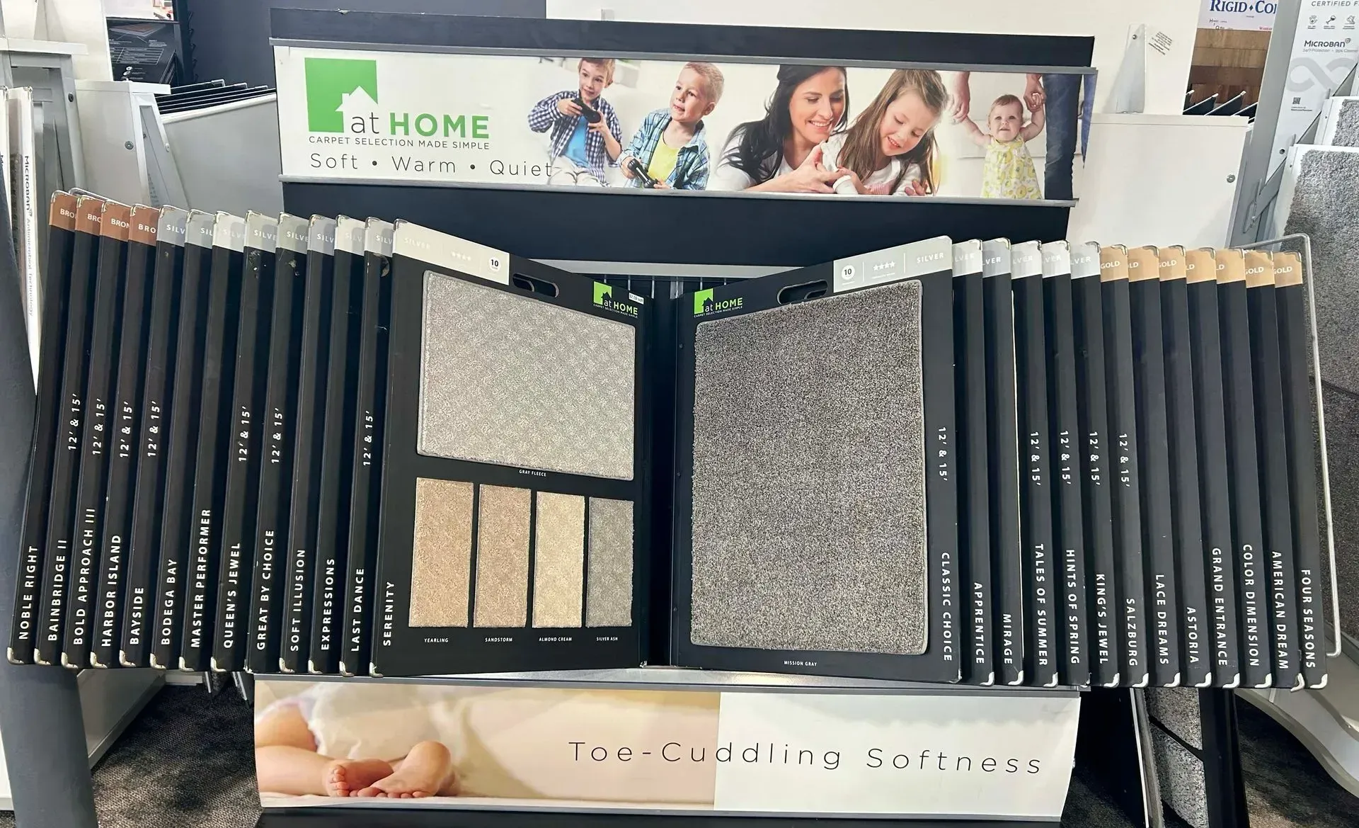 A display of carpets with the word home on it