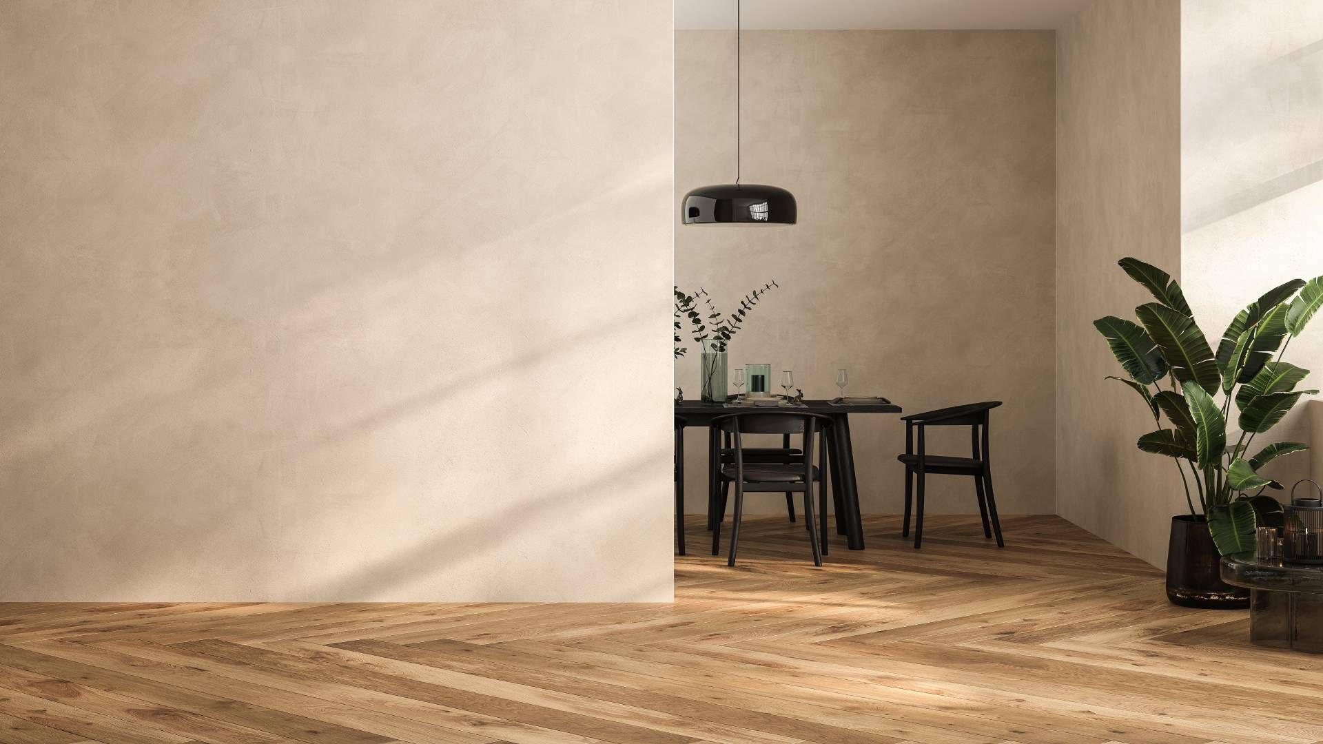 A dining room with a table and chairs and a plant.