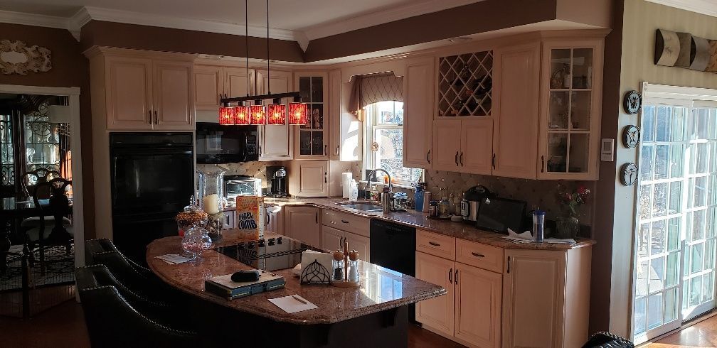 A kitchen with a large island in the middle of the room.