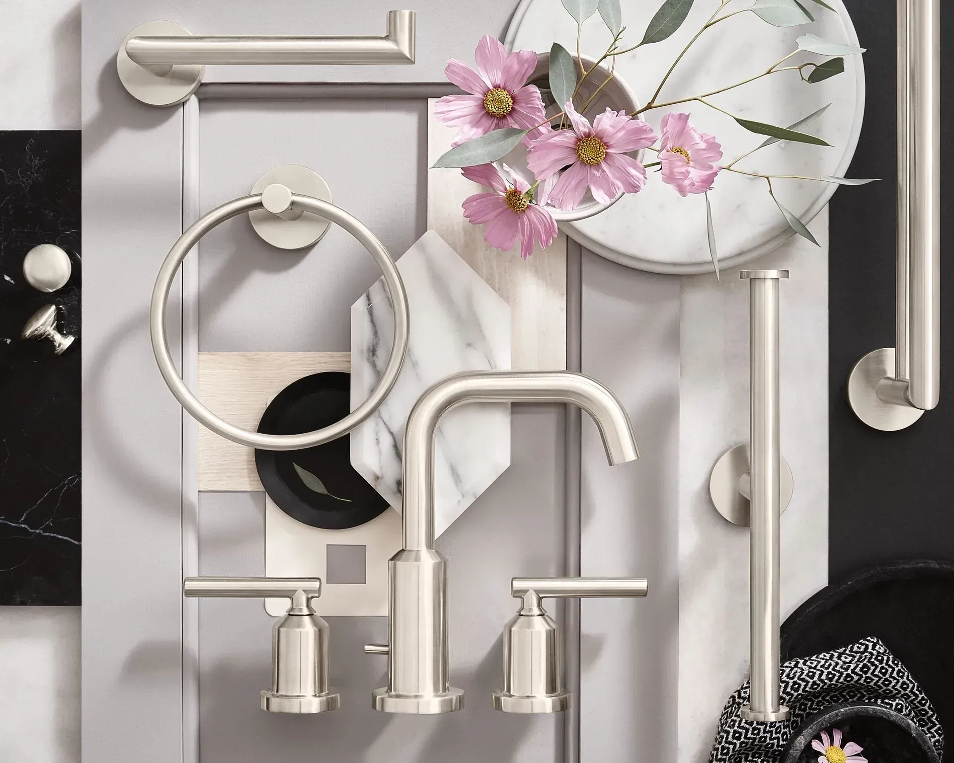 A picture of a bathroom with a faucet and flowers