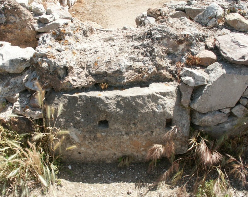 Tiryns, gravel boulder with rectangular holes