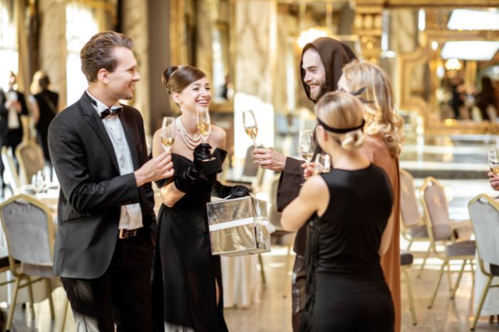 people surrounding each other having a toast at a gala