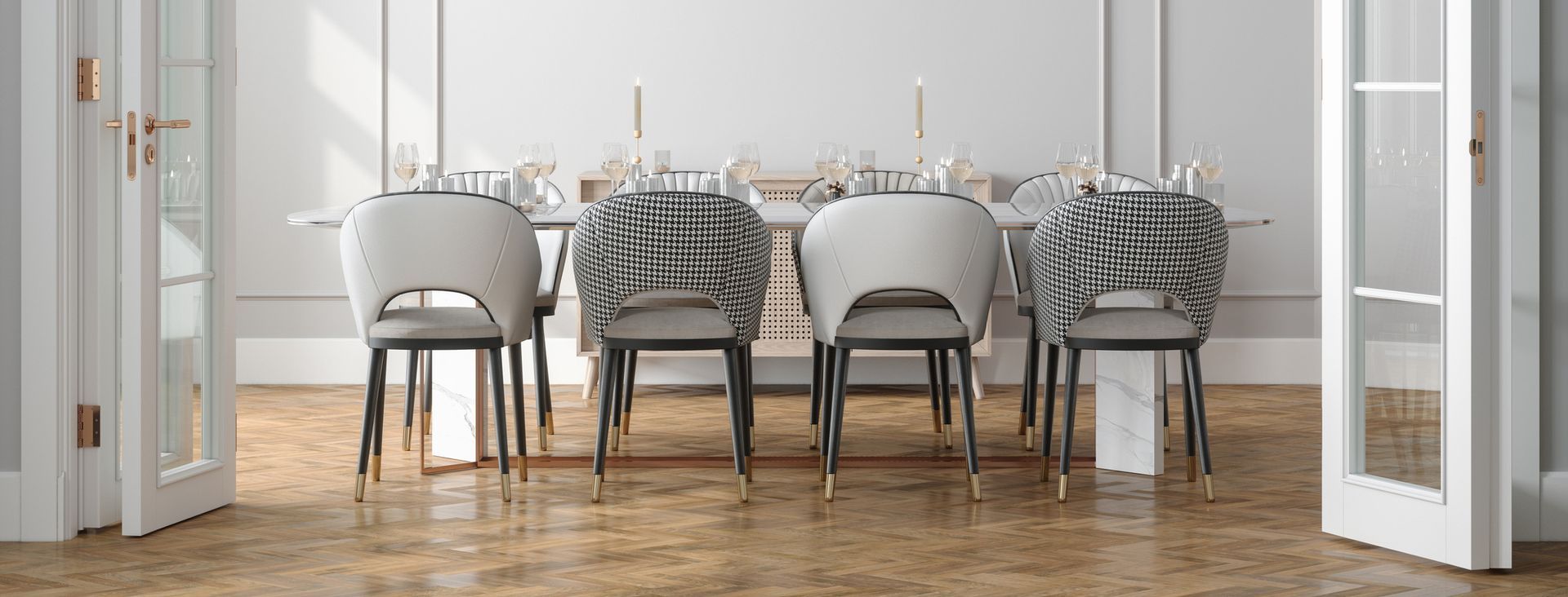 Dining room with a long white table, six chairs, and open French doors.