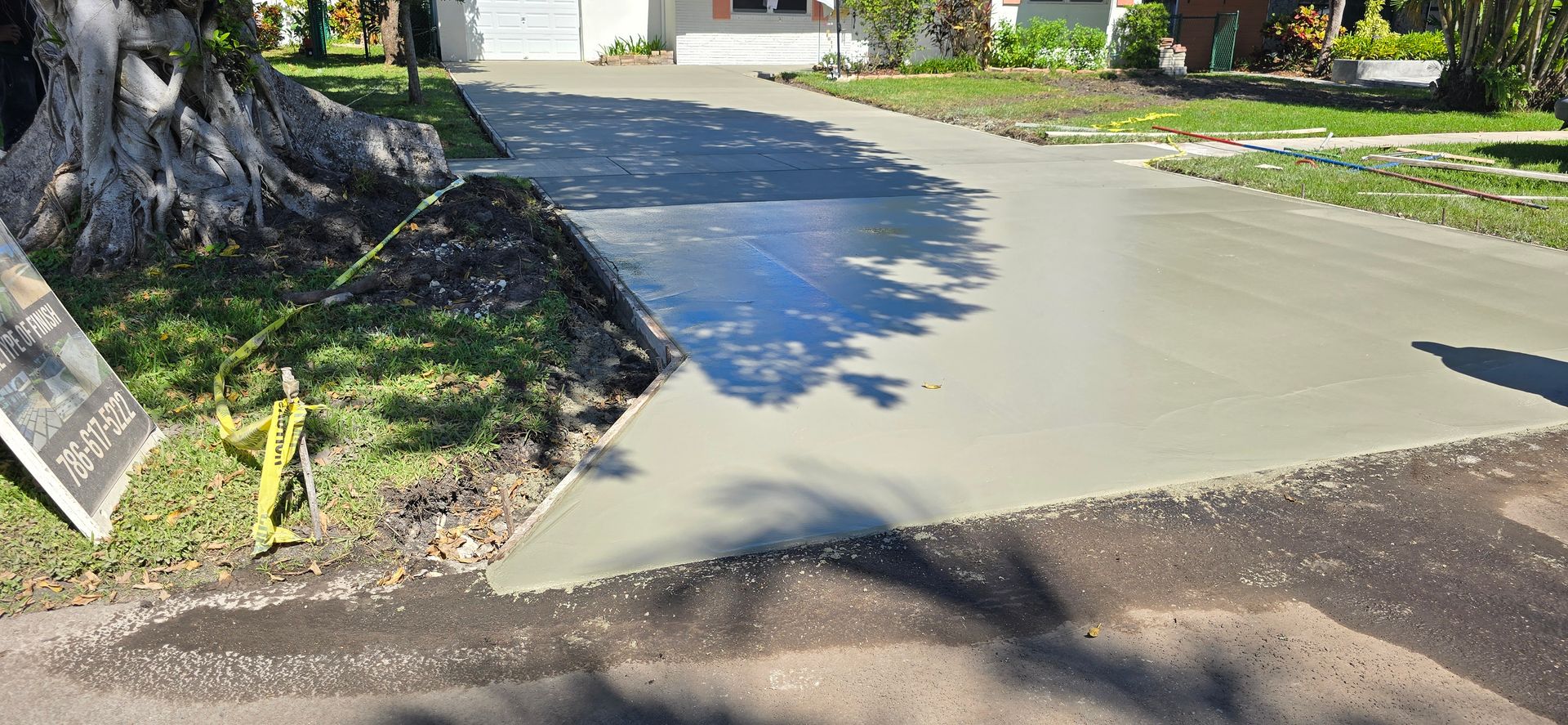 A Concrete Driveway Is Being Built in Front of A House.