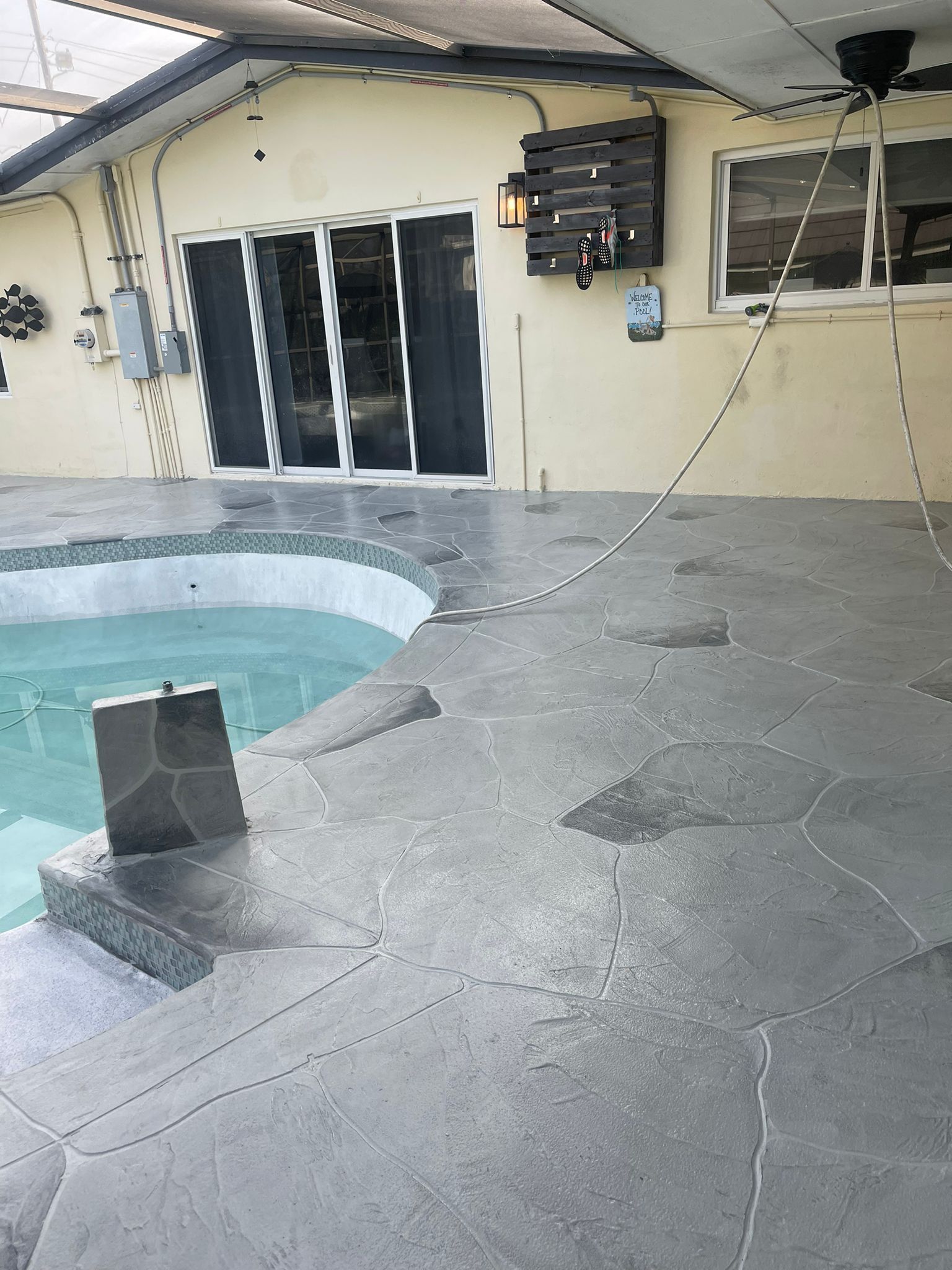 There Is a Swimming Pool in The Backyard of A House.