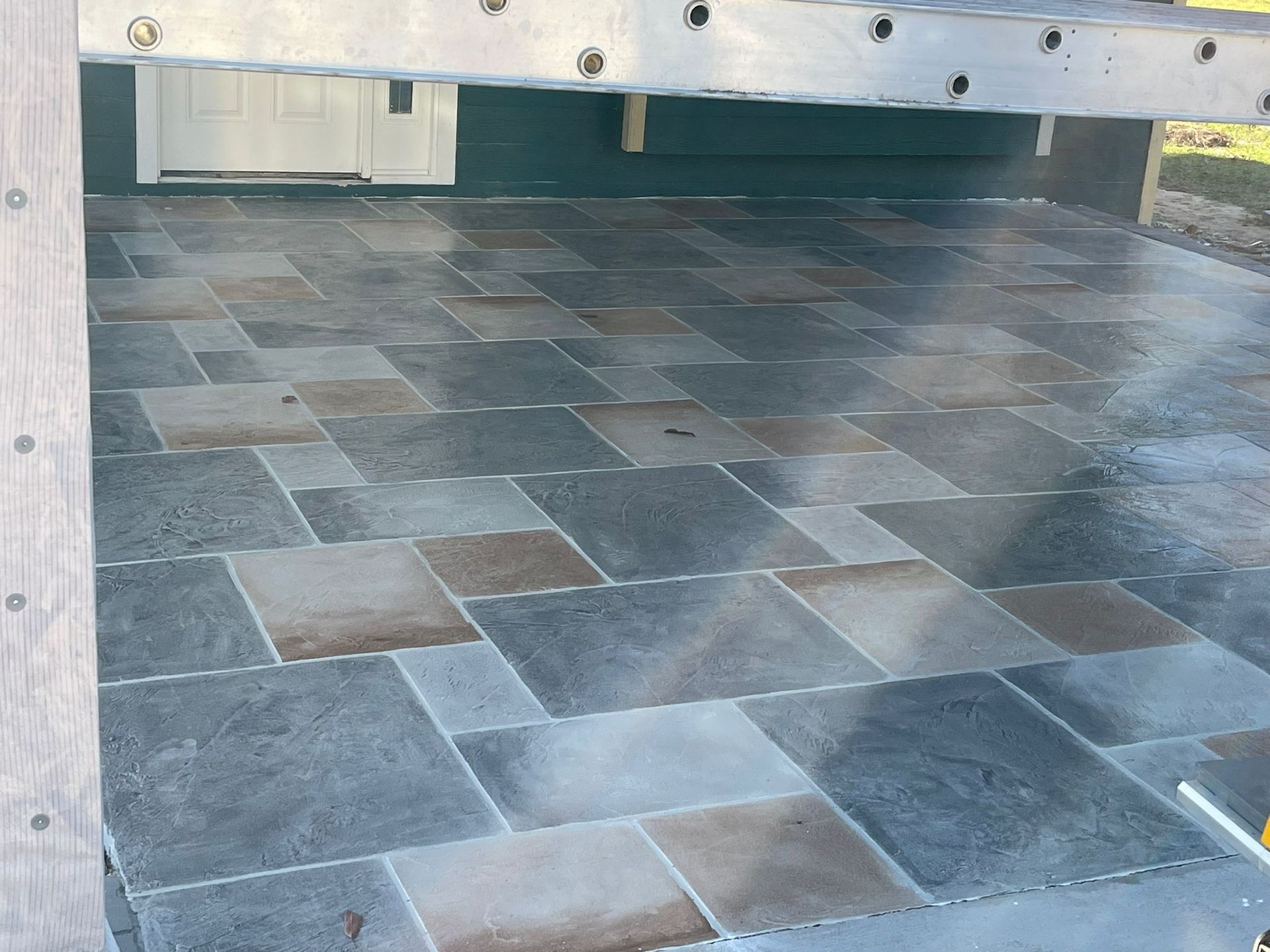 A Tiled Floor with A Wooden Fence in The Background