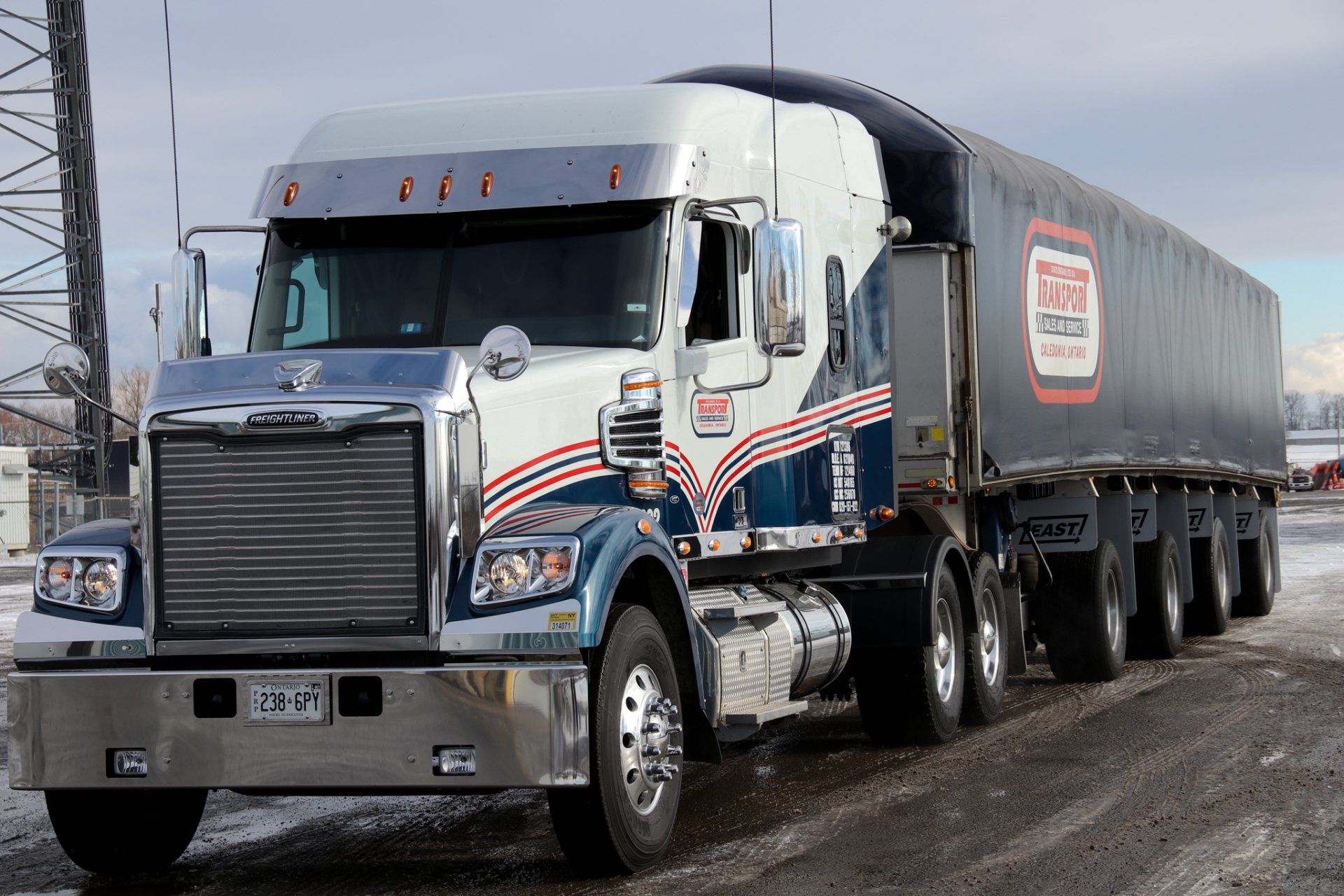 A large semi truck is parked on the side of the road