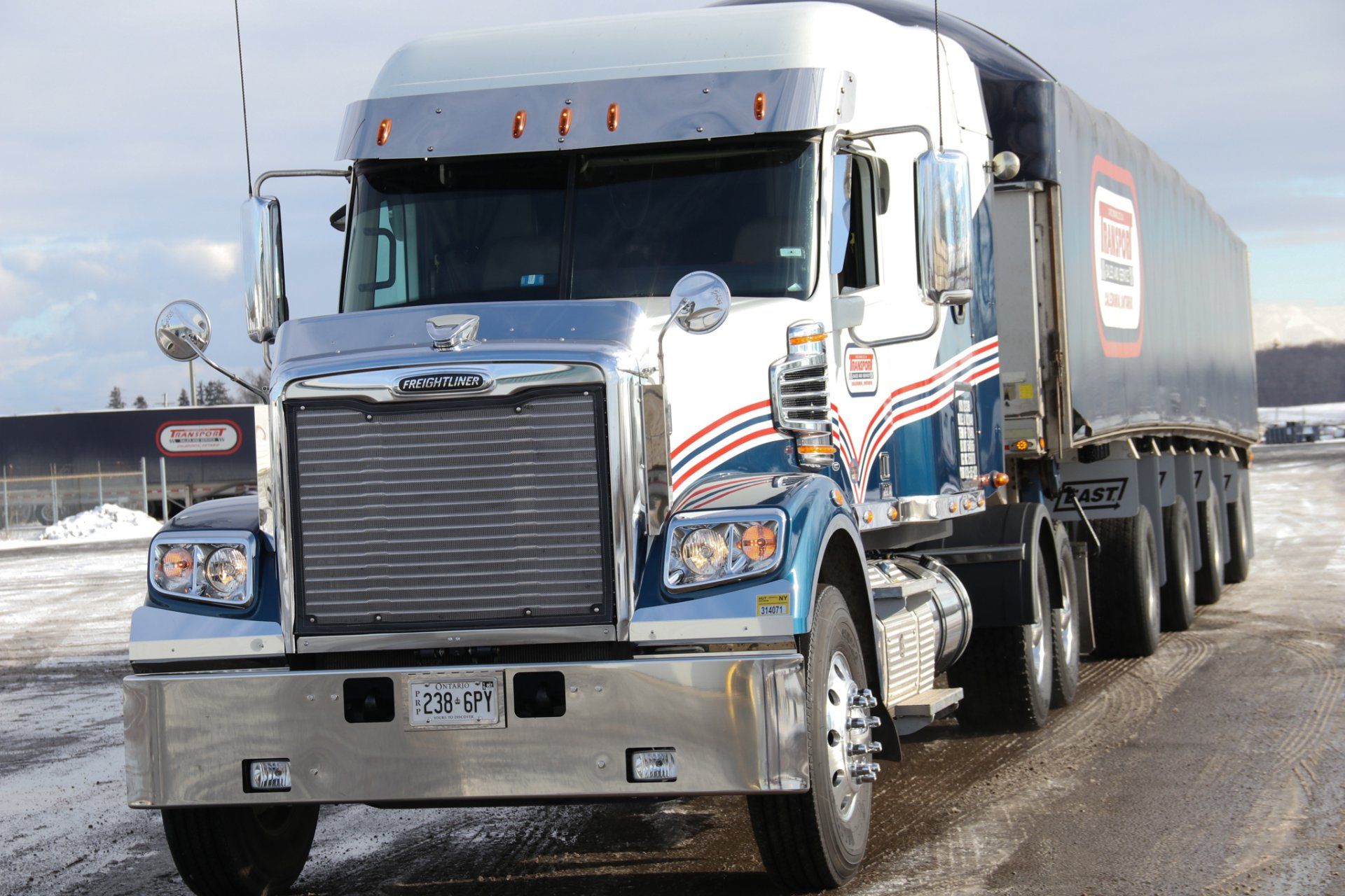 A large semi truck is parked on the side of the road
