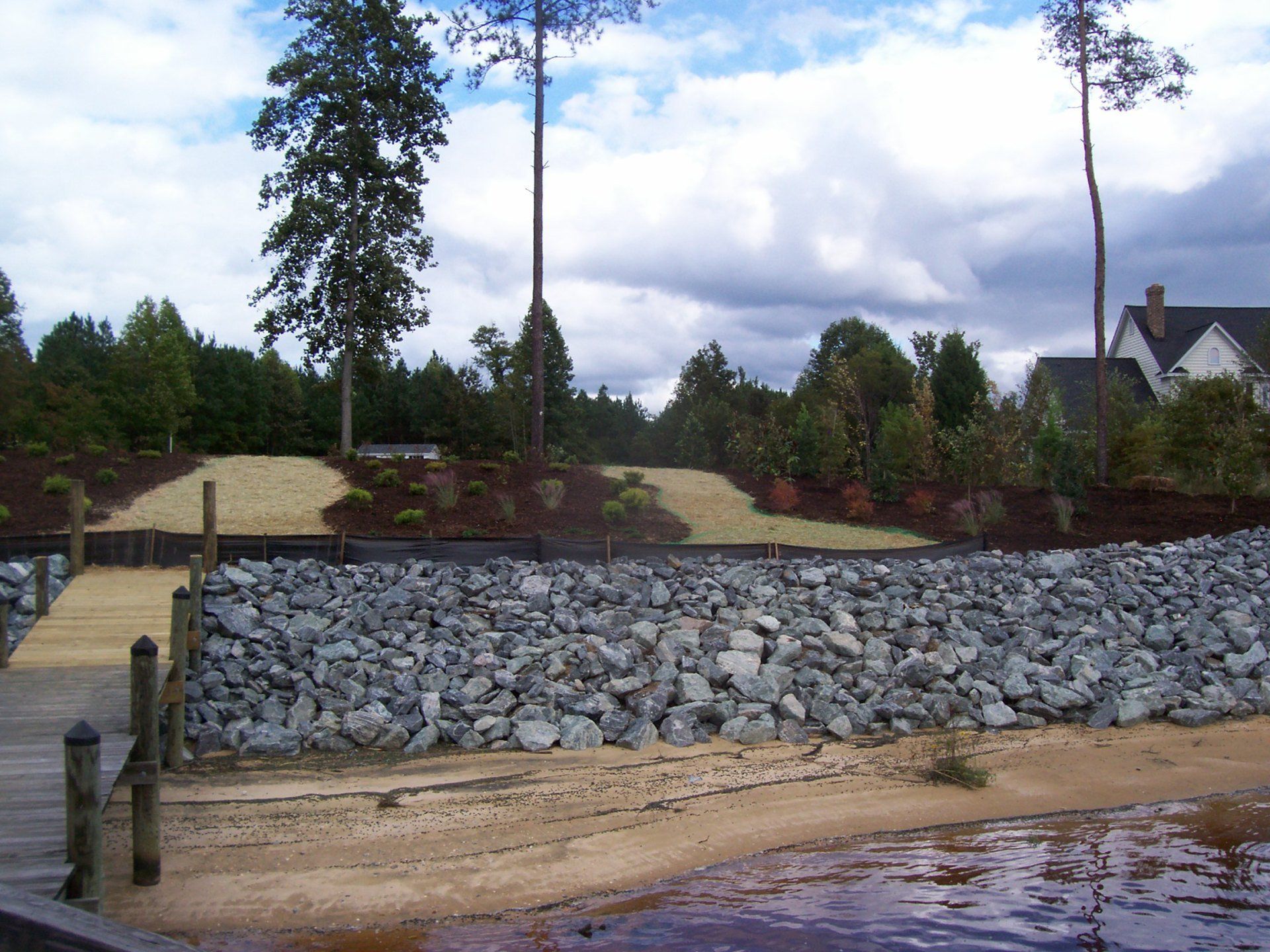 Drainage Installation — Backyard Field With Rip Rap in Shacklefords, VA