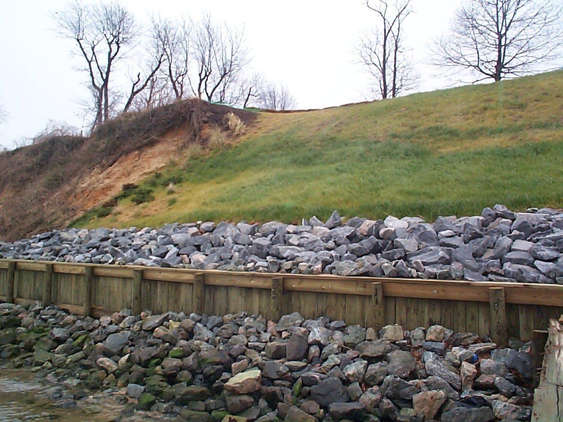 Hardscapep Installation — Wooden Seawall With Rip Rap in Shacklefords, VA