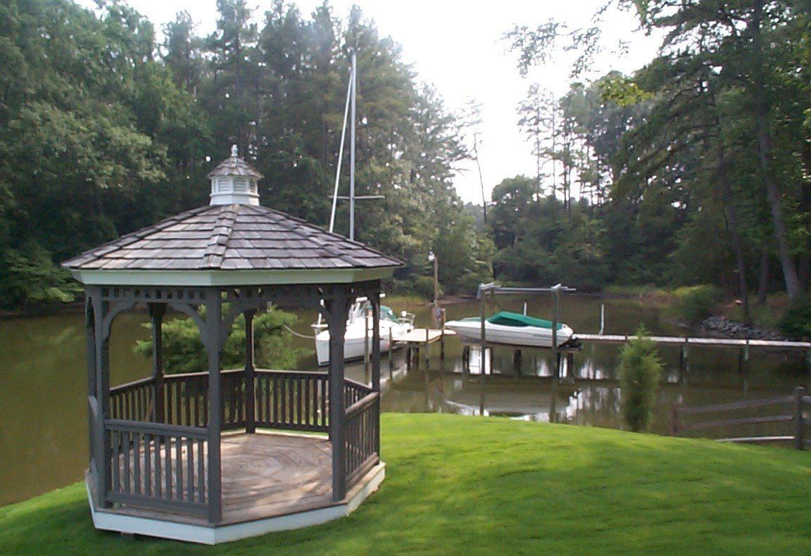 Decks — Large Pond With Two Speed Boat in Shacklefords, VA