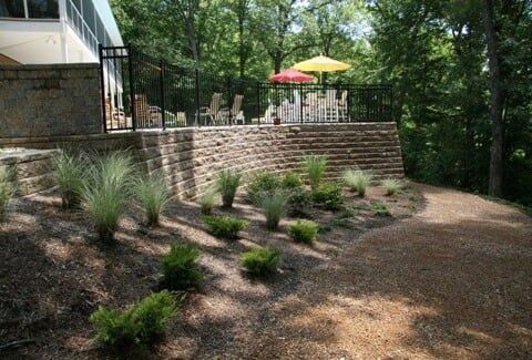 Custom Home Installation — Retaining Wall With Chairs On Top in Shacklefords, VA