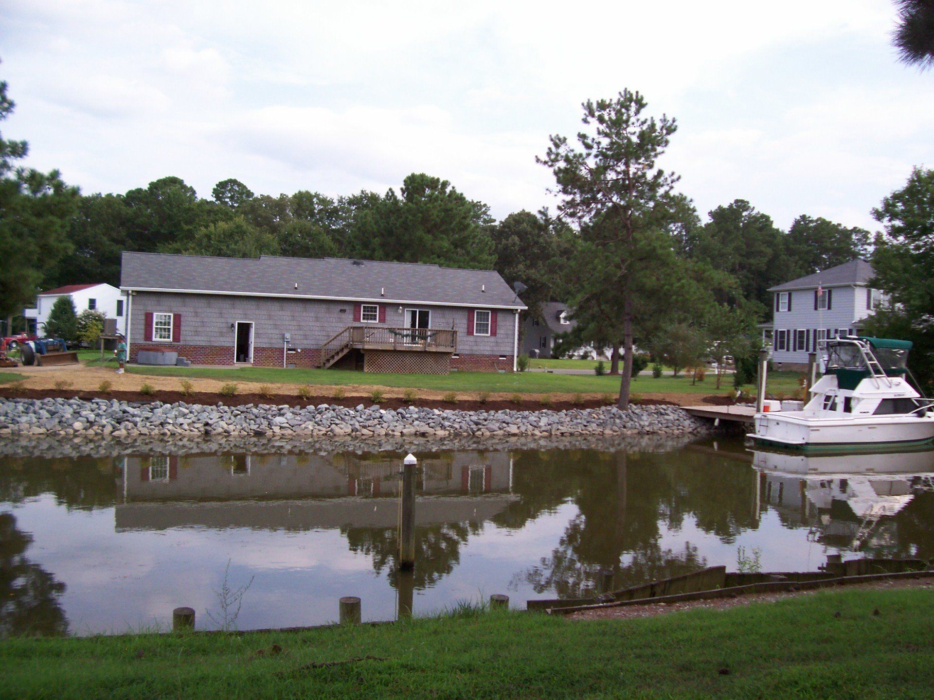 Irrigation Design & Installation — Rip Rap With Tree And Speed Boat in Shacklefords, VA
