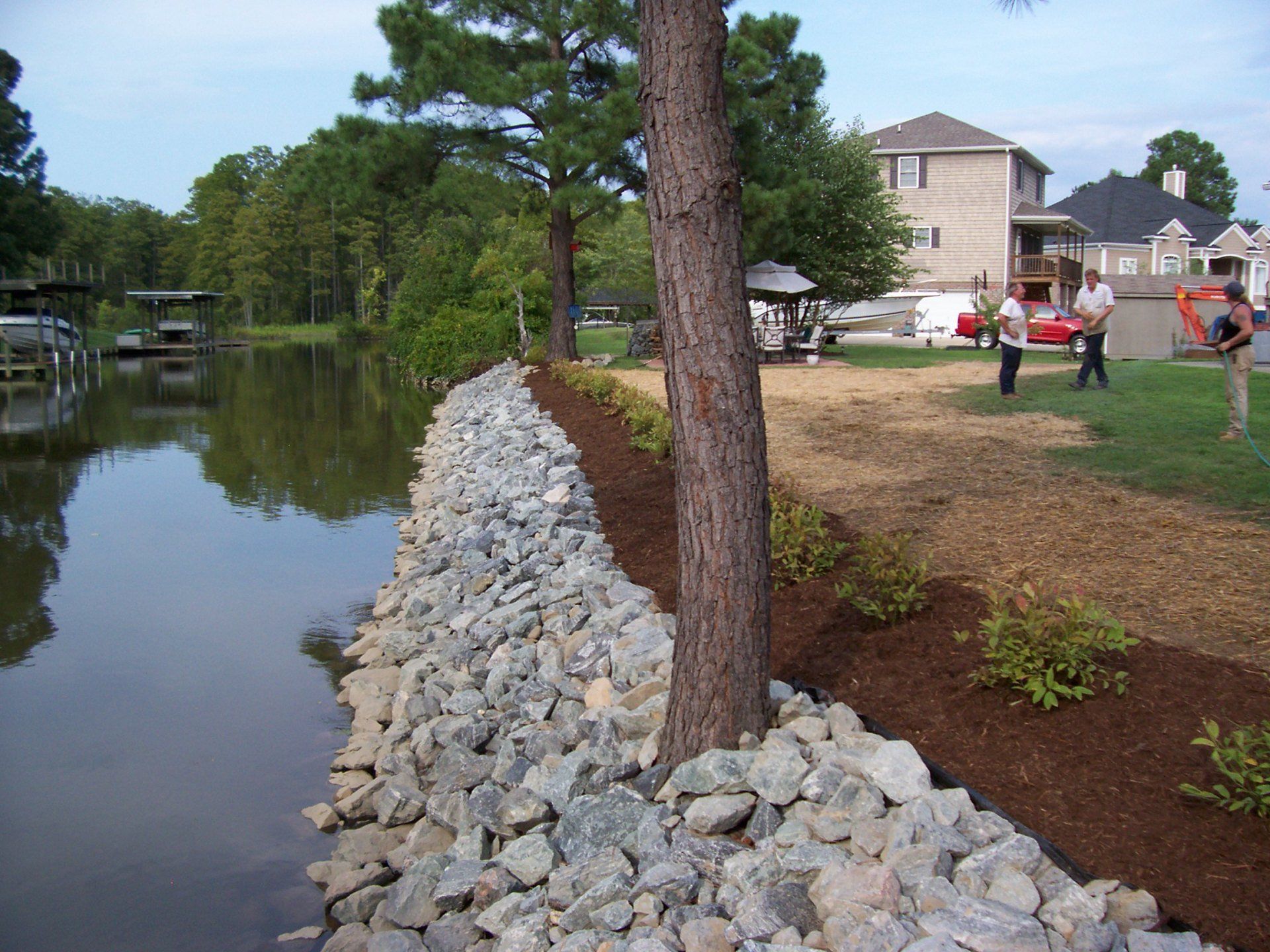 Landscaping Erosion Control — Housing Community With Lake On Side in Shacklefords, VA