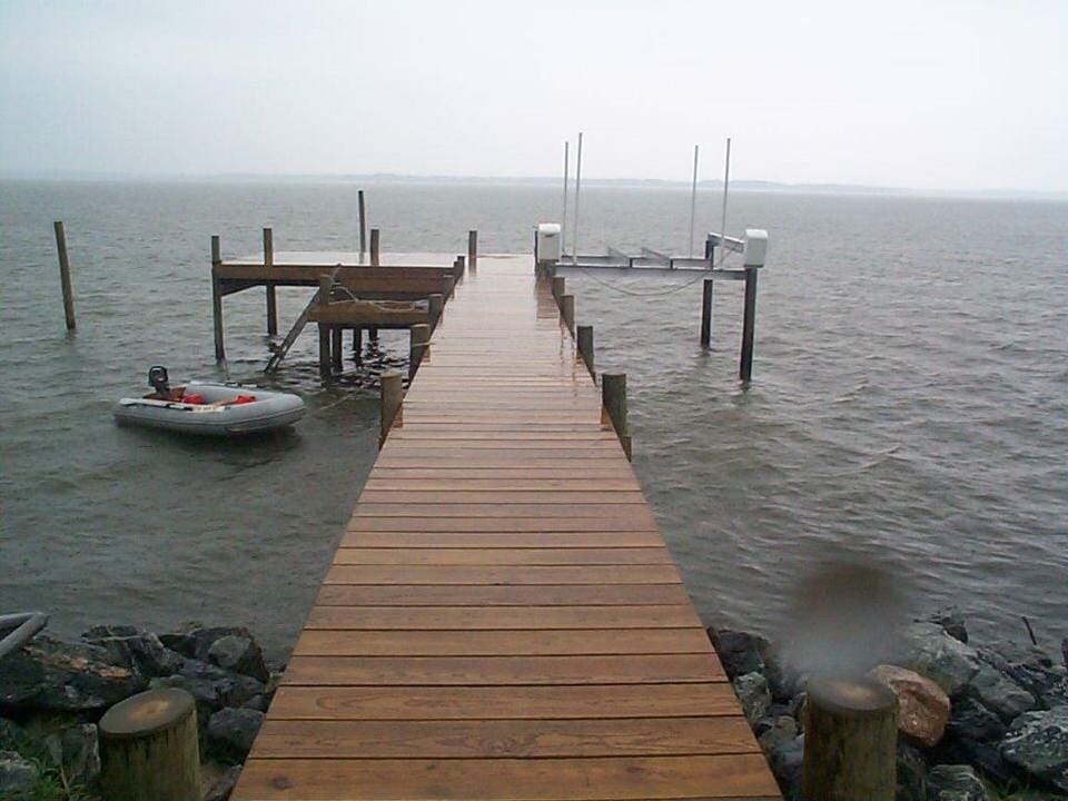 Retainer Walls Repair — Wooden Dock With Life Boat in Shacklefords, VA