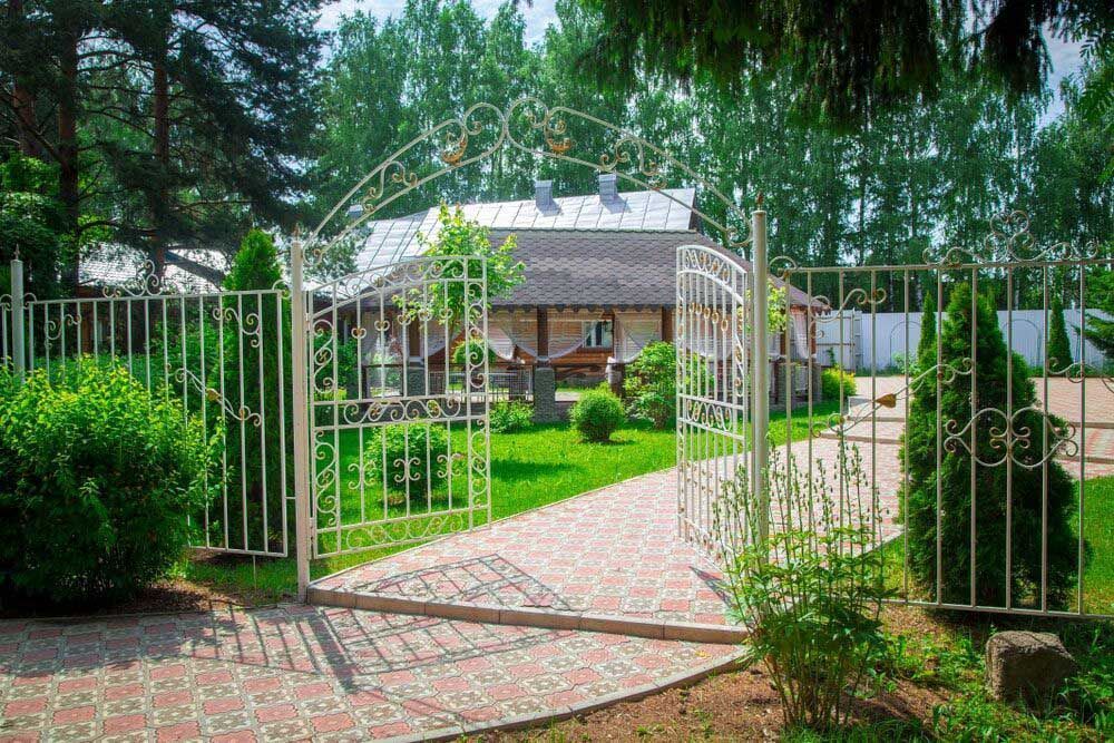 A Wrought Iron Gate Leading to a House in the Woods — Hastings Valley Powdercoaters in Port Macquarie, NSW