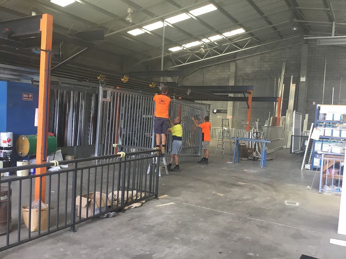 A Group of People Are Working in a Large Warehouse — Hastings Valley Powdercoaters in Wauchope, NSW