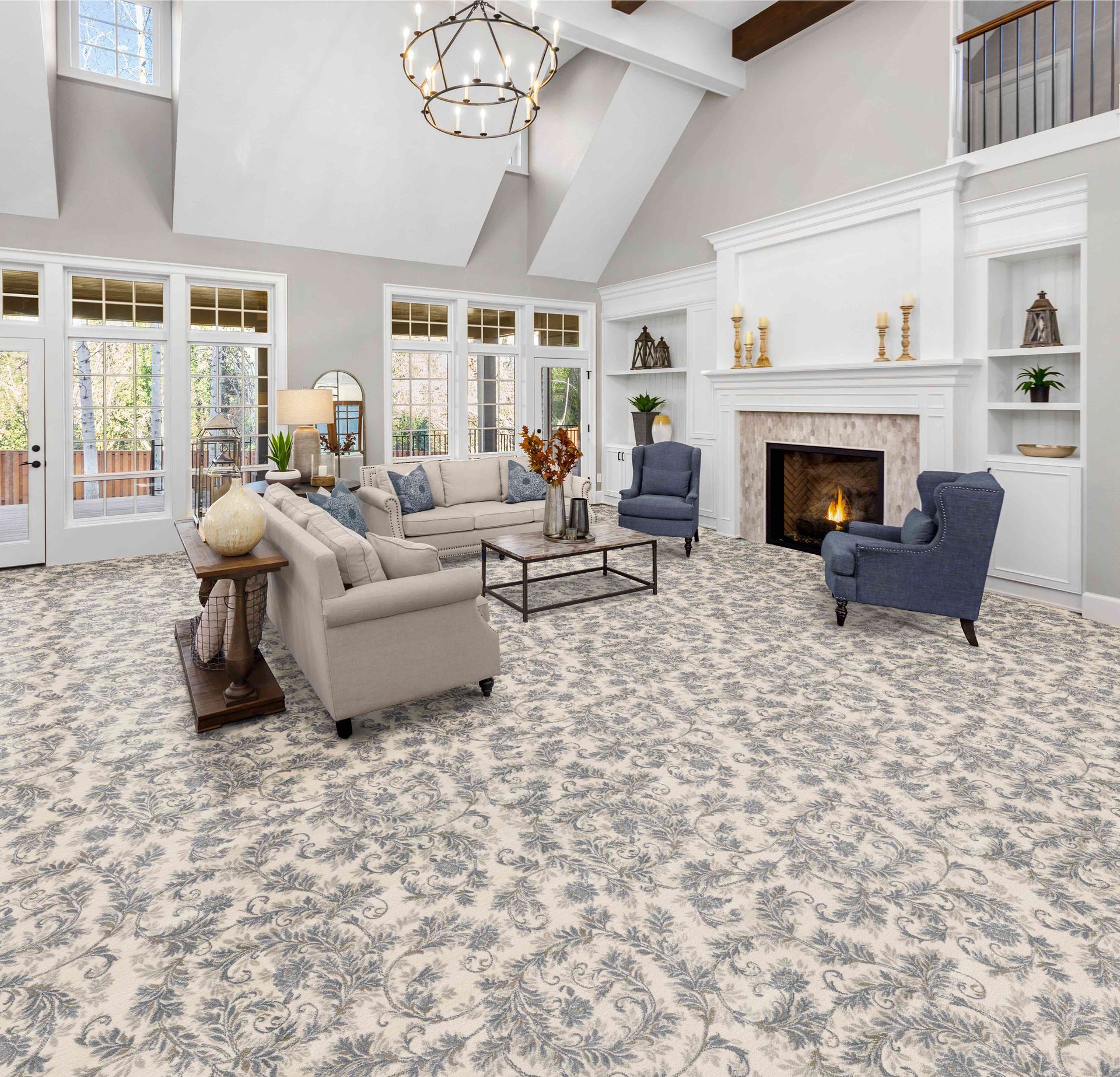 Living room with floral patterned carpet, fireplace, and furniture.