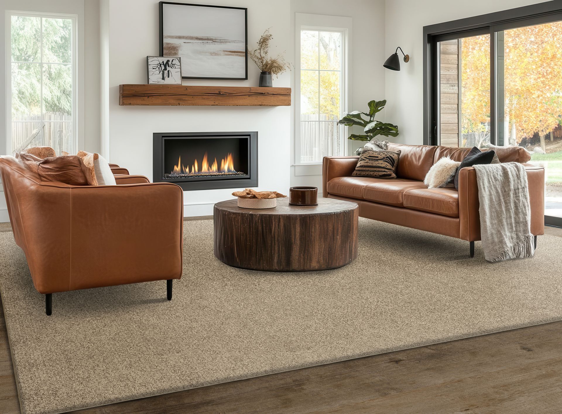 Living room with brown leather sofas, fireplace, and a wooden coffee table on a beige rug.