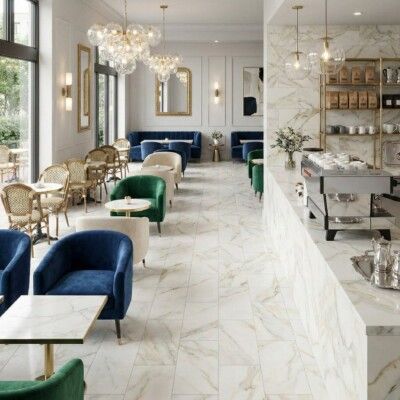 Elegant cafe interior with marble floors, seating areas, and a bar.