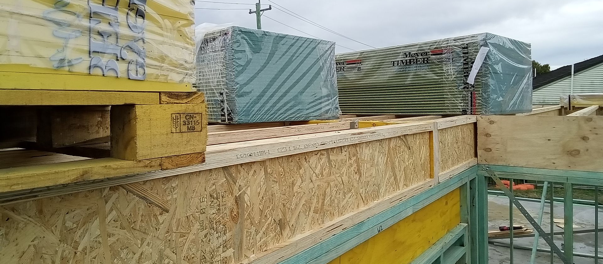 Timber floor framing materials delivered to residential construction site