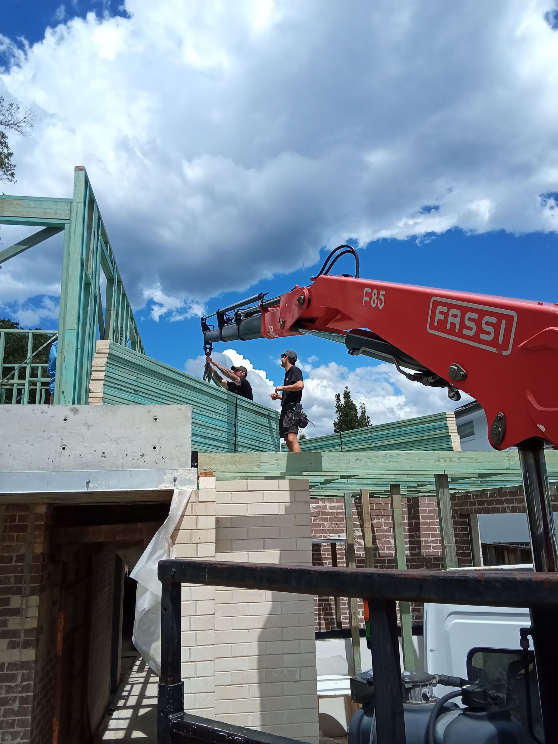 Gyamea Bay Crane Delivering Roof Trusses on site to builders