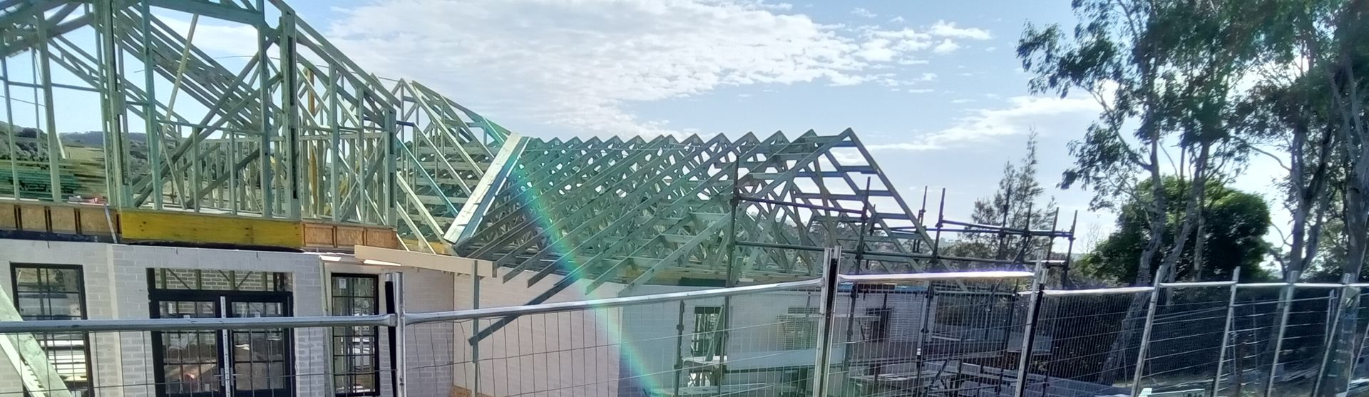 Prefabricated timber roof trusses installed on residential construction site in NSW