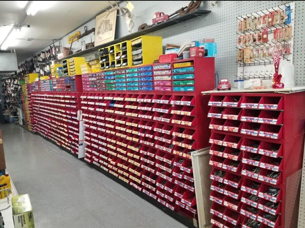 The inside of a hardware store with lots of shelves and drawers