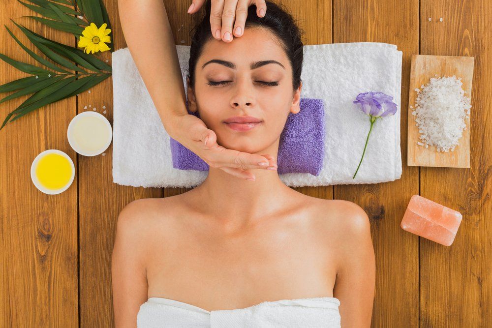 A Woman is Getting a Head Massage at a Spa — Shona's Lingerie in Hermit Park, QLD