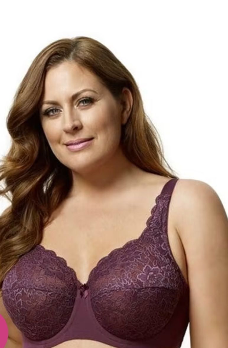 A Woman is Wearing a Purple Bra and Smiling — Shona's Lingerie in Hermit Park, QLD