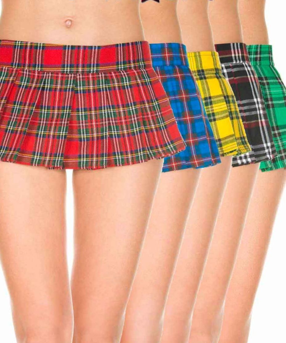 A Woman Wearing a Red Plaid Skirt is Standing in a Row With Other Plaid Skirts — Shona's Lingerie in Hermit Park, QLD