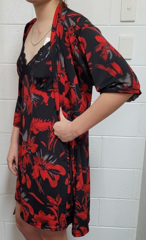A Woman is Wearing a Red and Black Floral Dress — Shona's Lingerie in Hermit Park, QLD