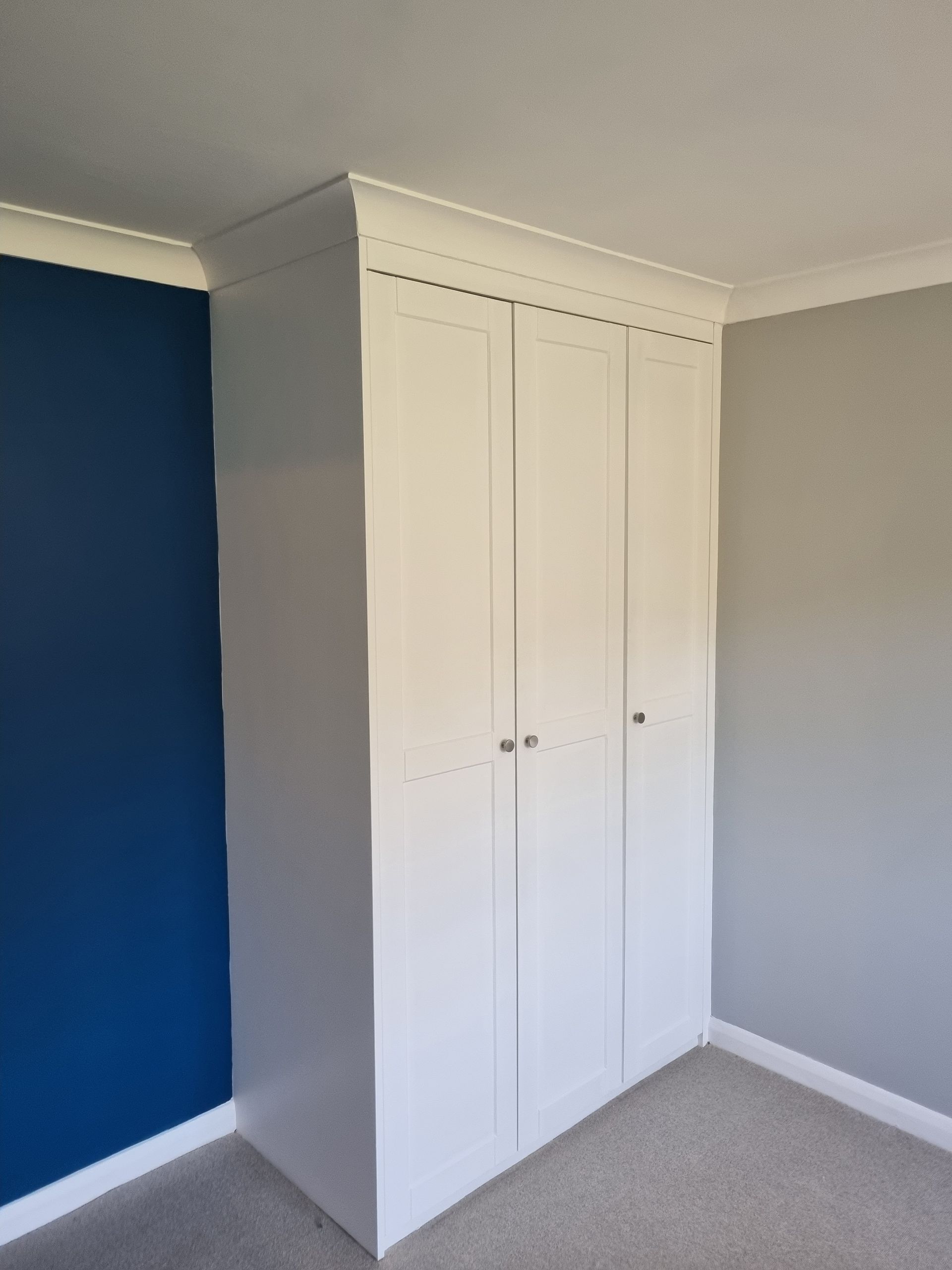 Made to measure built in wardrobe with new coving and plastering and decorating