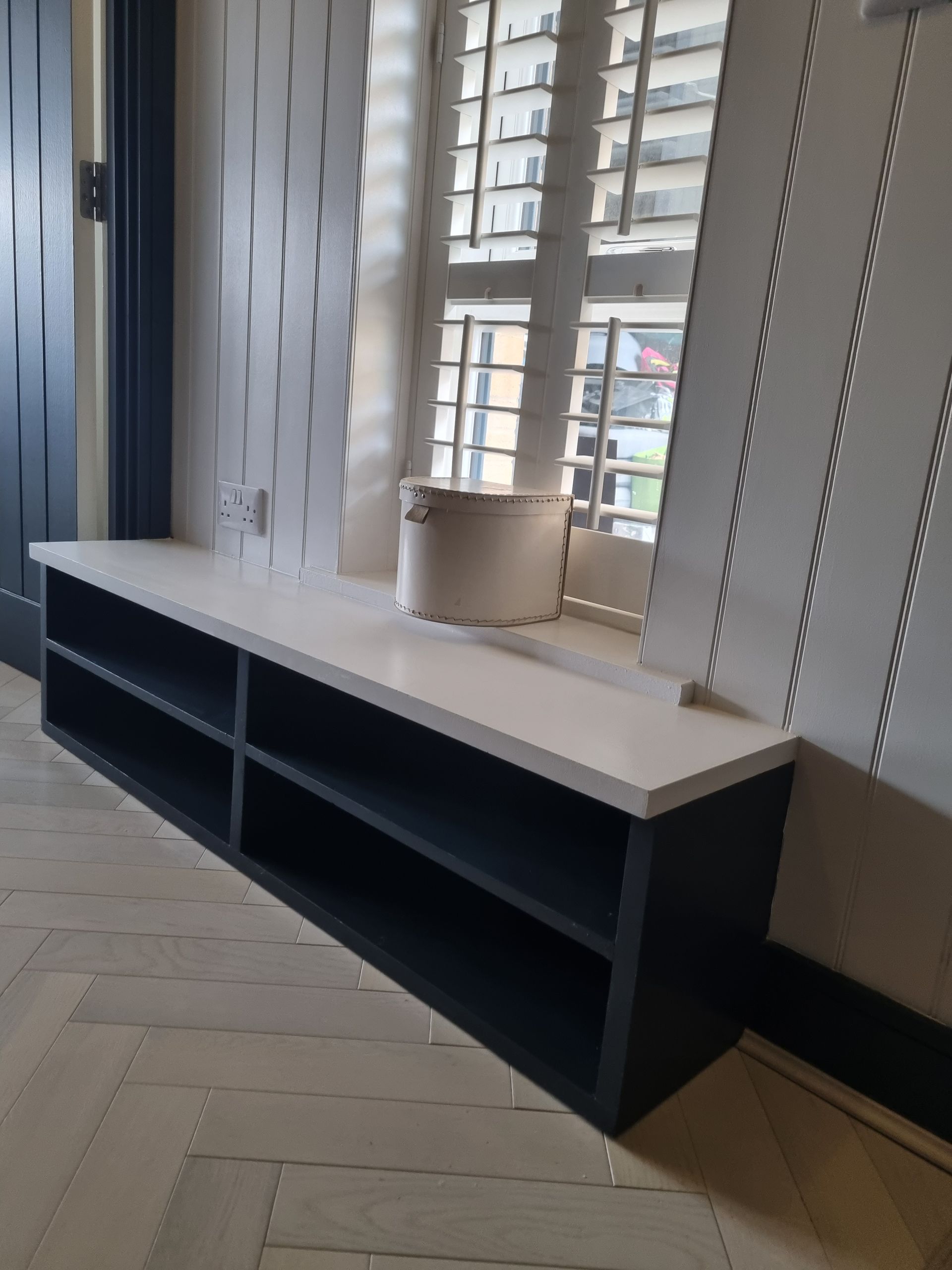 Bespoke shoe storage boot room and wall panelling with herringbone flooring