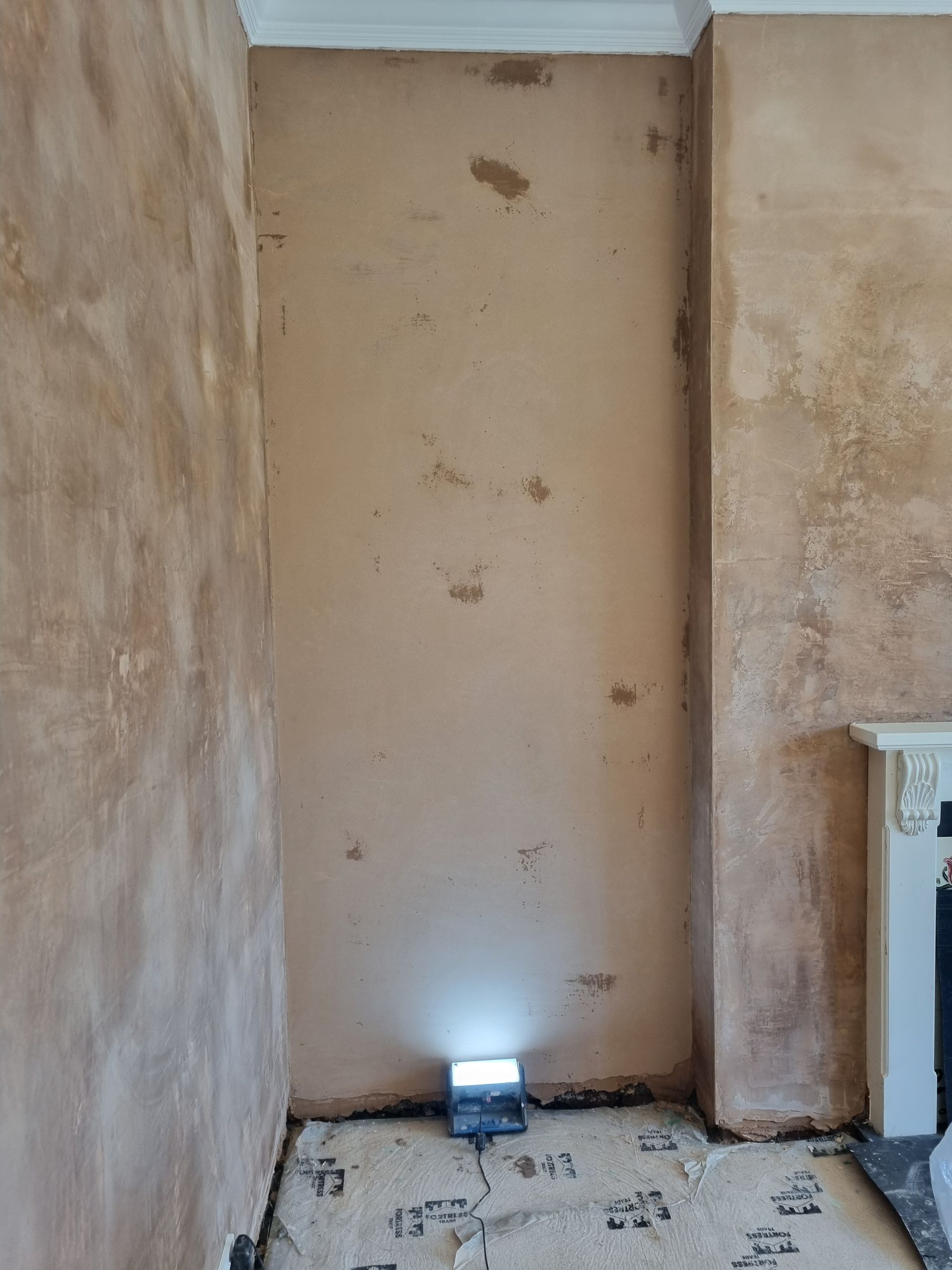 Walls skimmed, new plaster under light