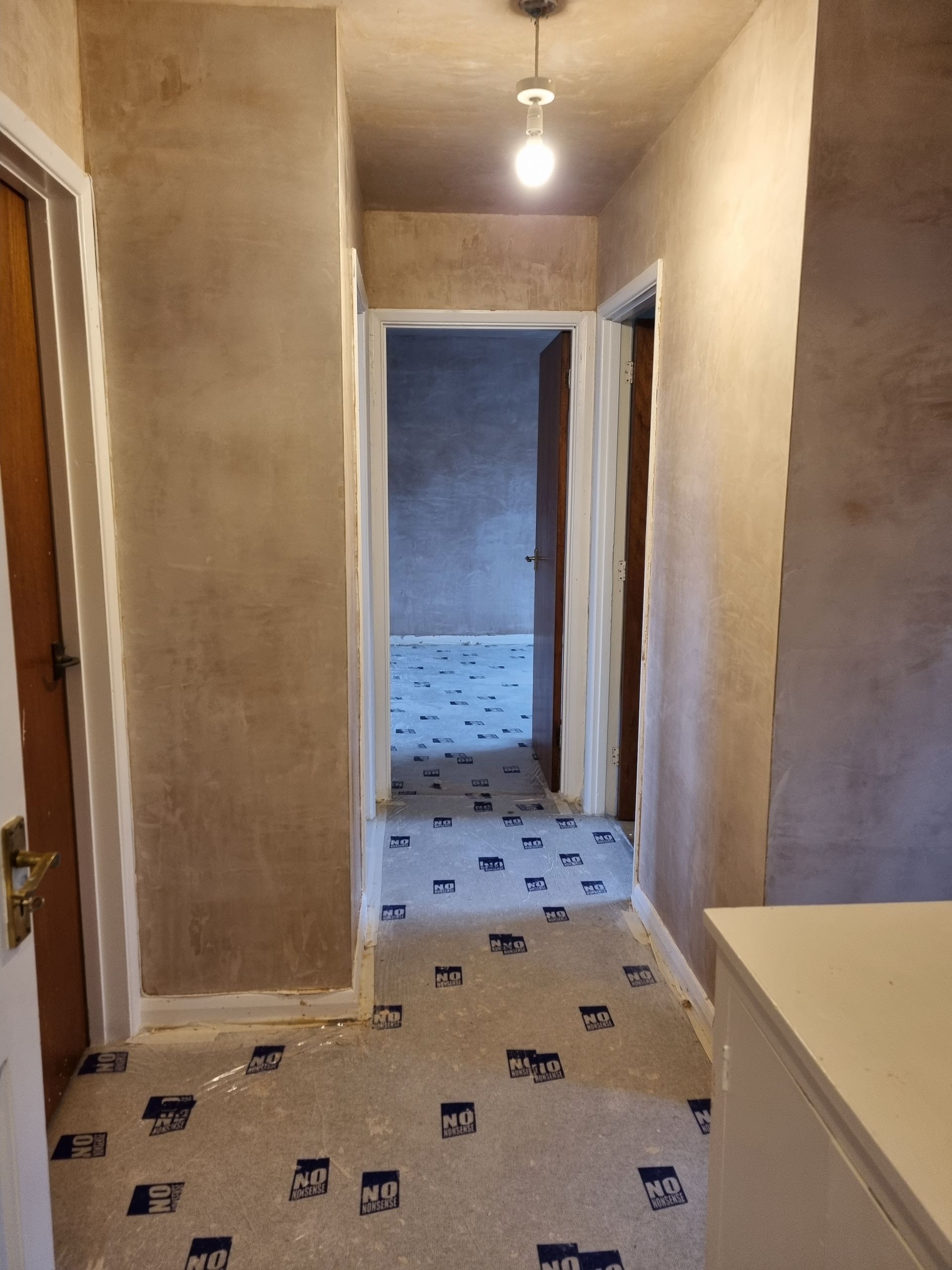 Hallway refurbishment new plaster and carpet protection
