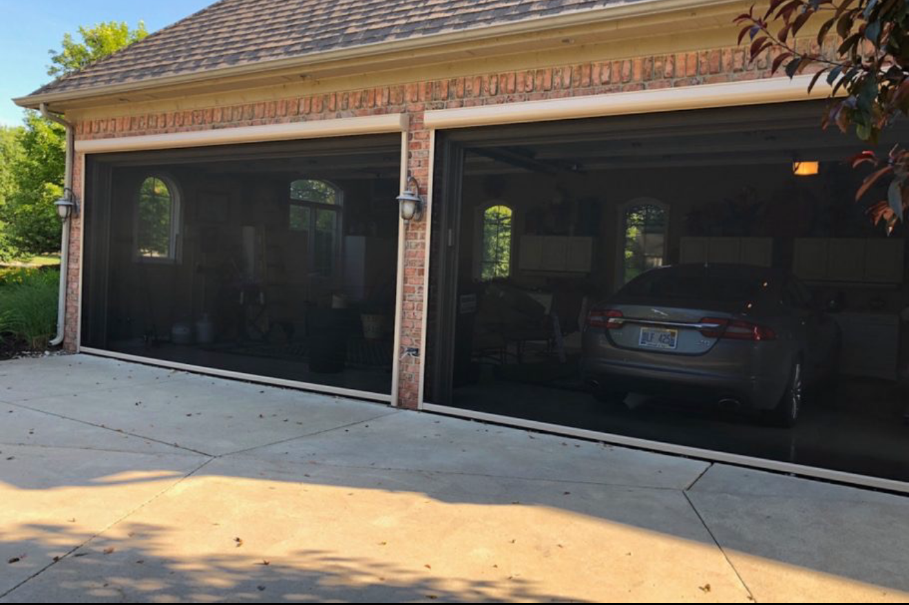 SunPro motorized exterior screen – patio – Palm Springs
A car is parked in a garage next to a house.