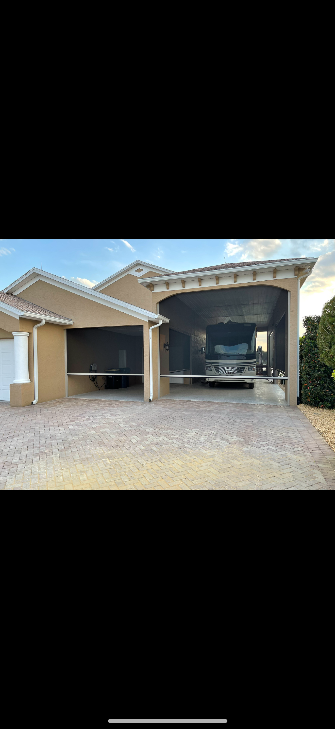 Custom poly plantation shutters – Chino Hills
A truck is parked in a garage in front of a house.
