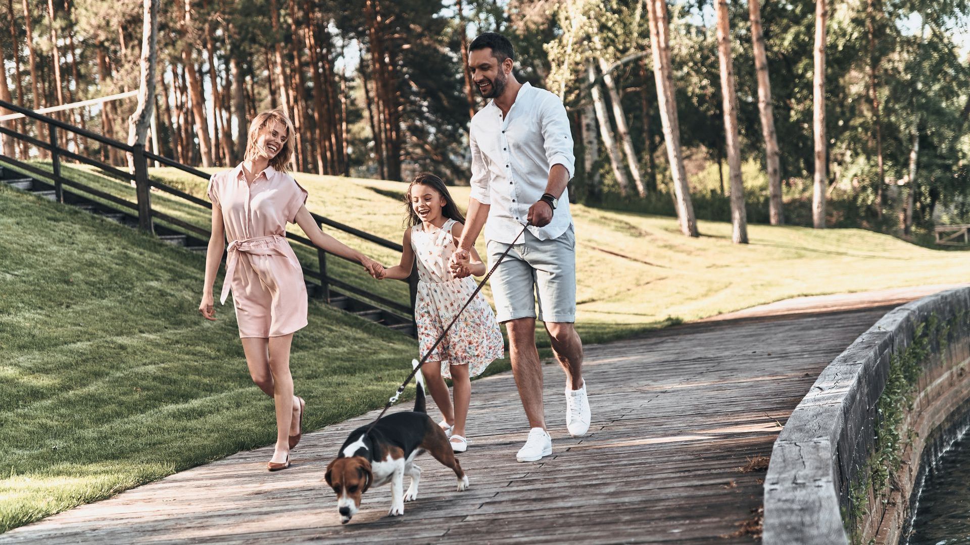 Family walking together with a pet