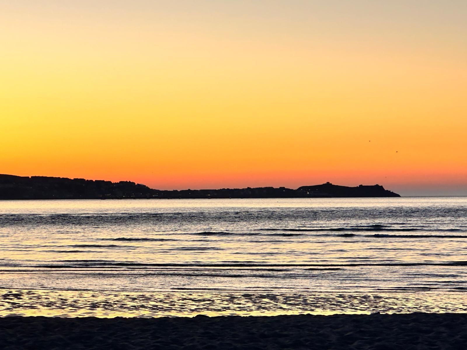 sunset over St Ives Bay, ideal setting for an unforgettable escape room cornwall adventure
