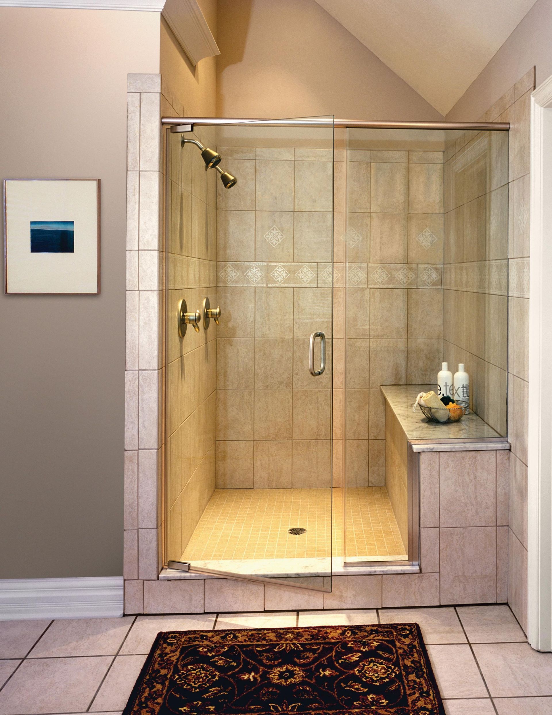 A bathroom with a sliding glass shower door